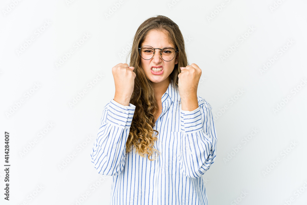 Young caucasian woman upset screaming with tense hands. Young caucasian woman upset screaming with tense hands.