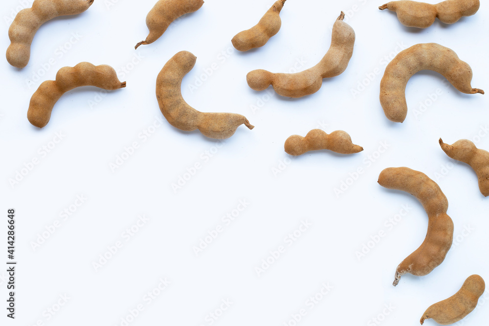 Tamarind tropical fruit on white background. Top view Tamarind tropical fruit on white background. Top view