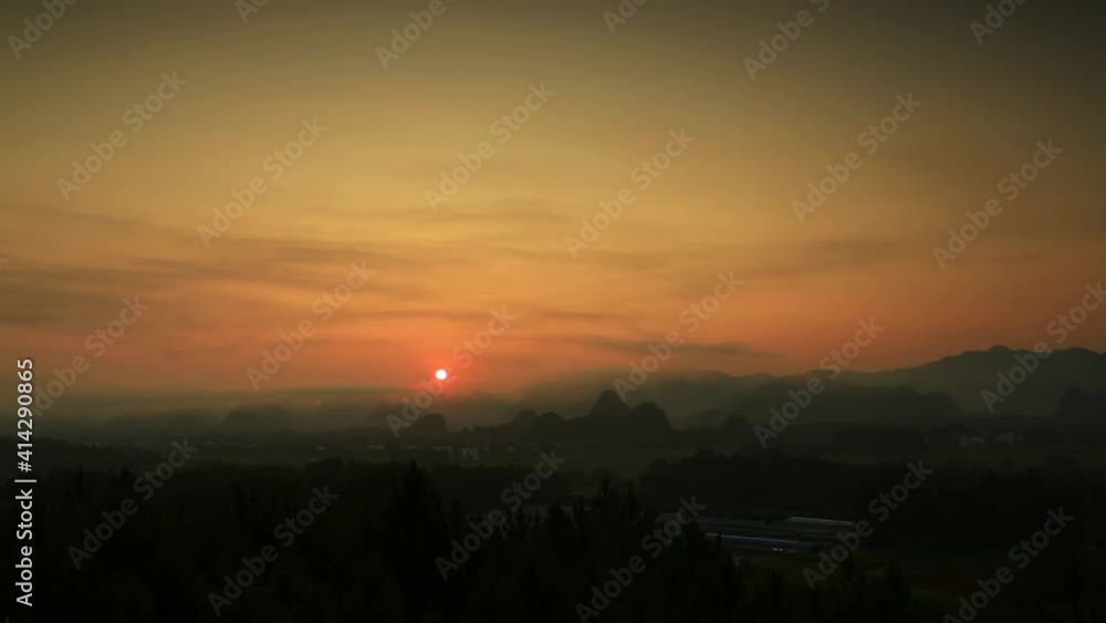 Time-lapse, rural scenery at sunrise, foggy mountains and village Time-lapse, rural scenery at sunrise, foggy mountains and village
