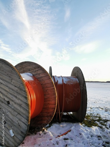 Two Glas Fibre cable on a winter meadow
