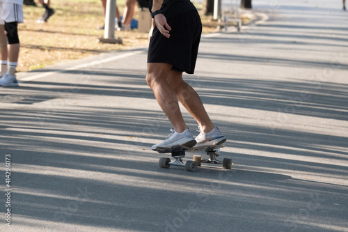 A man playing skateboard in park.