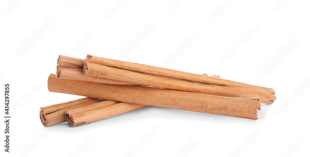 Aromatic brown cinnamon sticks on white background