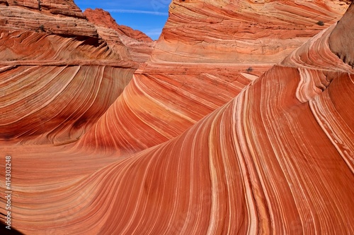 Textured sandstone red buttes under the blue sky. Utah and Arizona states of Southwest. United States of America
