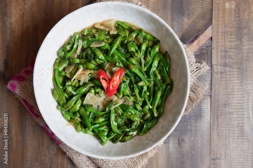 a plate of sauteed limnocharis flower or sawah-lettuce flower on the table   photo