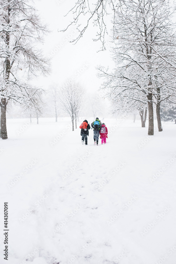 Kids walking in the snow