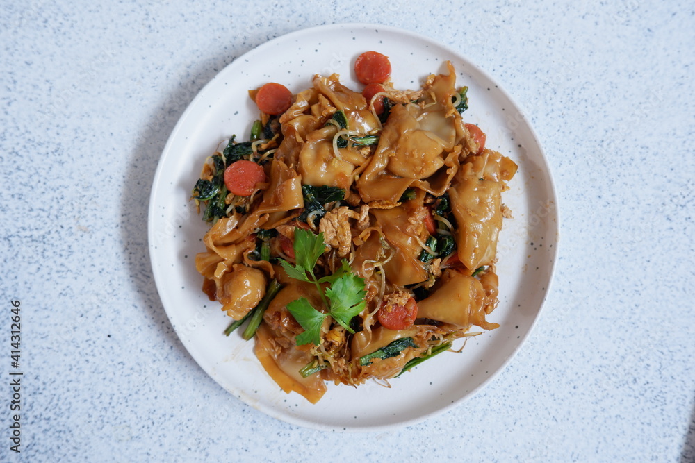 a plate of fried chicken dumplings with vegetables in white background a plate of fried chicken dumplings with vegetables in white background