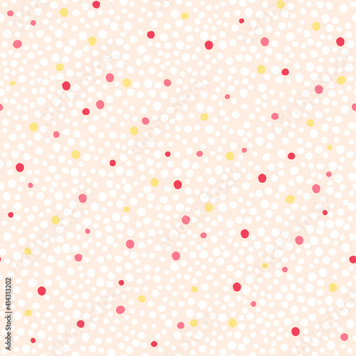 Seamless hand drawn dots pattern. White, pink, red and yellow dots on the white background. Abstract pattern for fabric, wrapping, wallpapers.