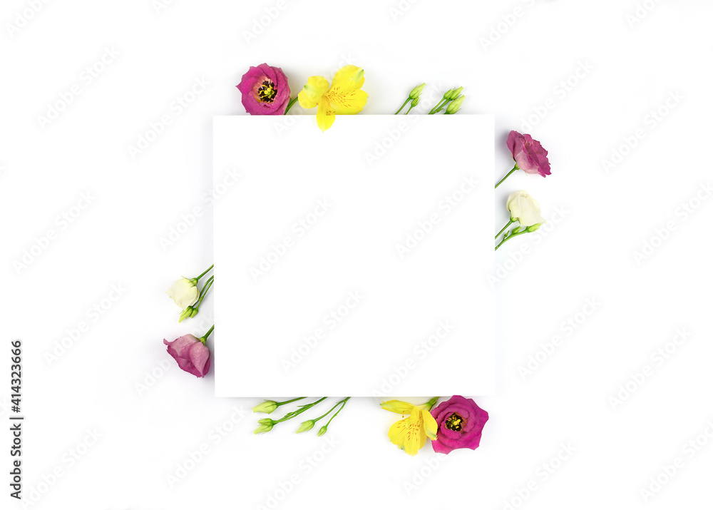 Fototapeta premium Spring composition. Flowers, paper blank white background. Flat lay, top view, copy space, mock up.