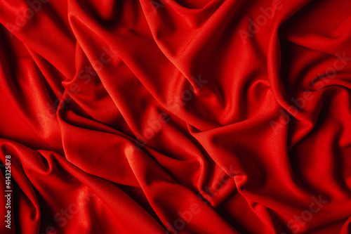 Red fabric with nice folds. Background for your product. Luxury draperies