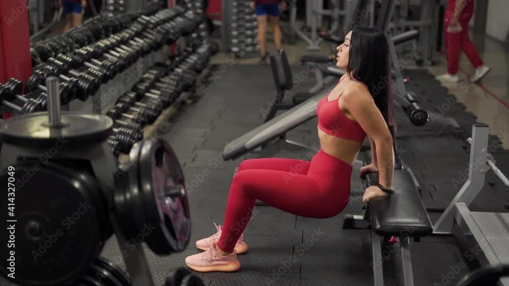 sports girl in a sexy suit is engaged in the gym sports girl in a sexy suit is engaged in the gym