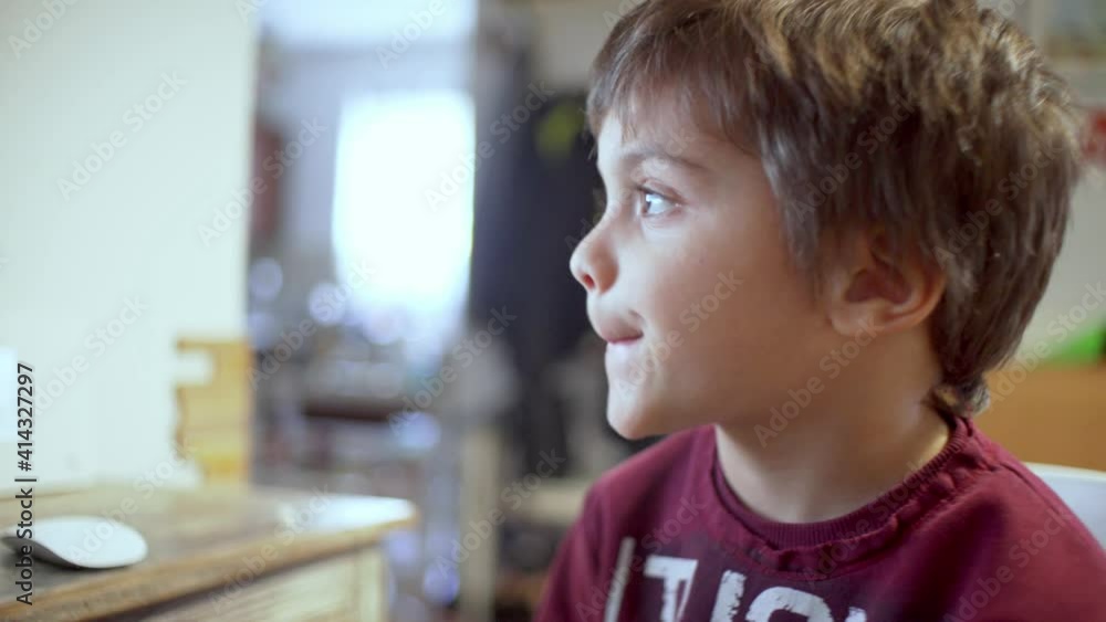 Close up shot of caucasian boy, doing distance education in front of the computer, pan 4K Close up shot of caucasian boy, doing distance education in front of the computer, pan 4K