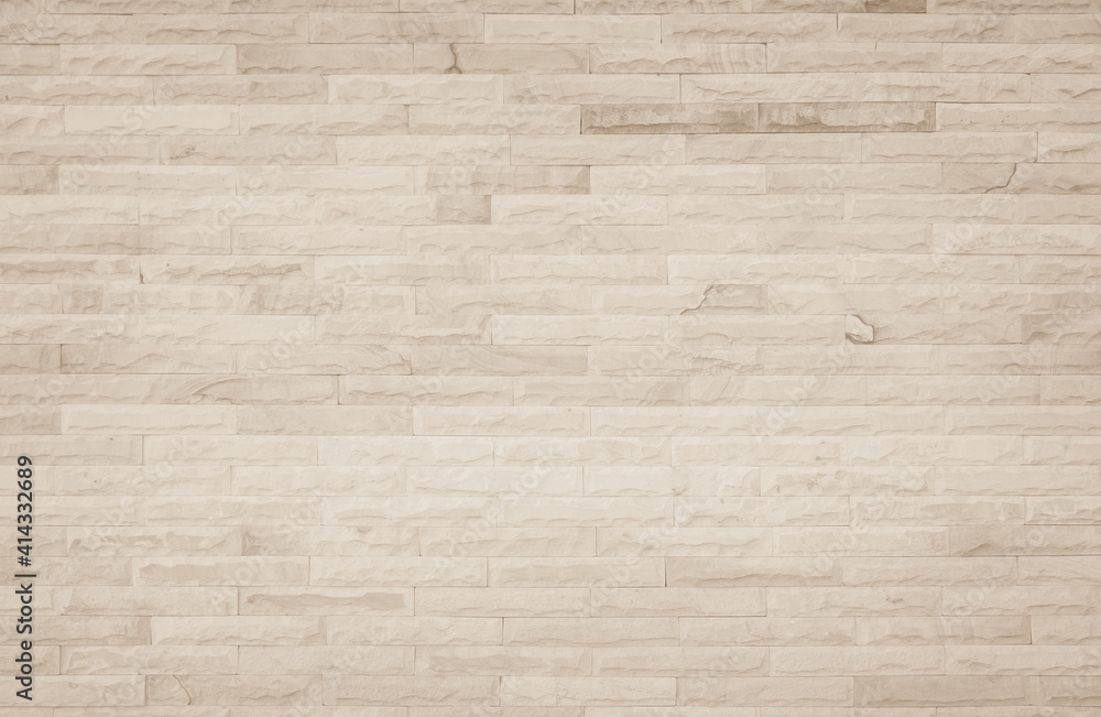 Fototapeta premium Empty background of wide cream brick wall texture. Beige old brown brick wall concrete or stone textured, wallpaper limestone abstract flooring/Grid uneven interior rock. Home decor design backdrop.