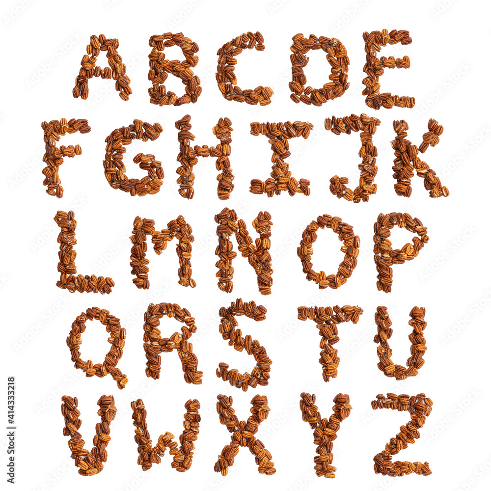 English alphabet from pecans on a white isolated background. Food pattern made from nuts. Bright alphabet for shops. English alphabet from pecans on a white isolated background. Food pattern made from nuts. Bright alphabet for shops.