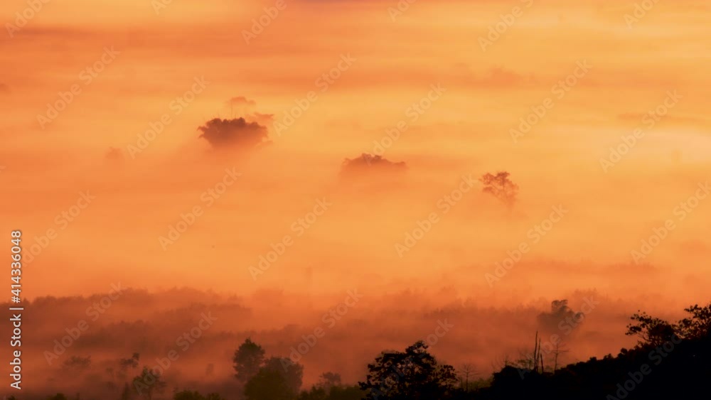 Scenic view of beautiful mountains with fog moving at sunrise. Sea of fog in winter early morning on peak of mountains. Scenic view of beautiful mountains with fog moving at sunrise. Sea of fog in winter early morning on peak of mountains.