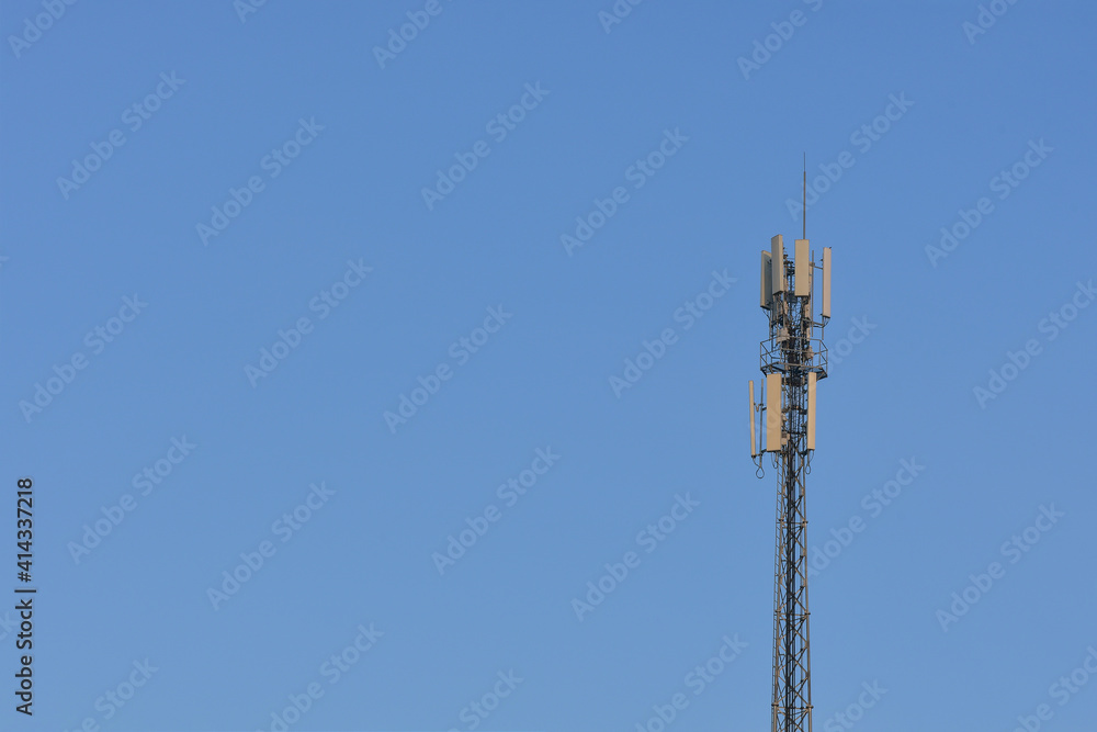 Cell phone signal tower on sky background with copy space Transportation system