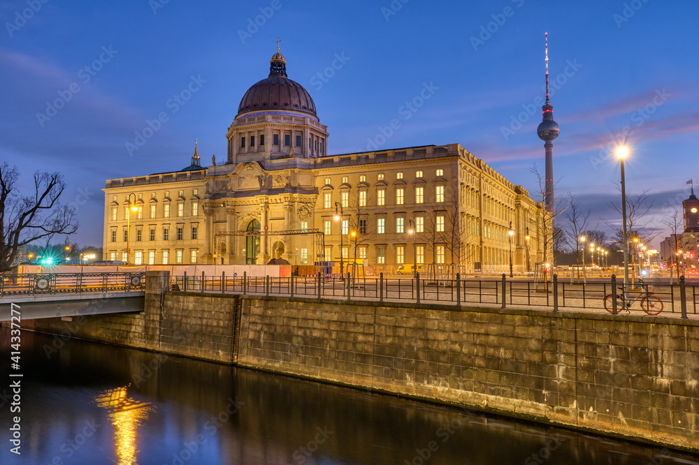 The imposing rebuilt Berlin City Palace with the Television Tower at dawn