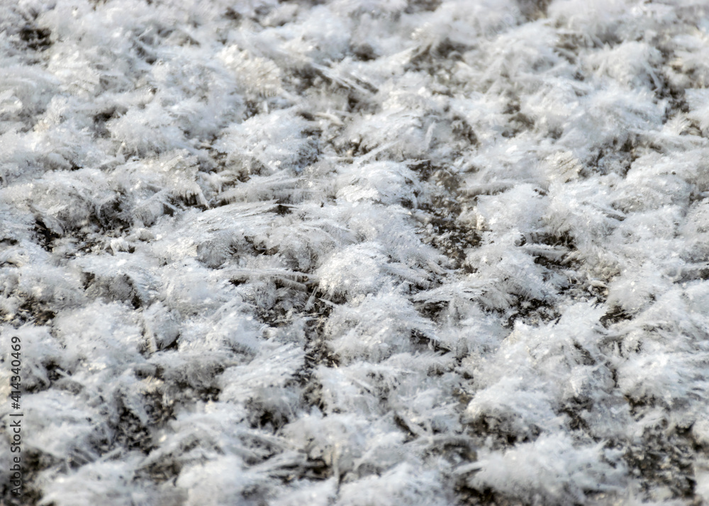 abstract snow texture, snow and frozen grass, shadows on the snow abstract snow texture, snow and frozen grass, shadows on the snow