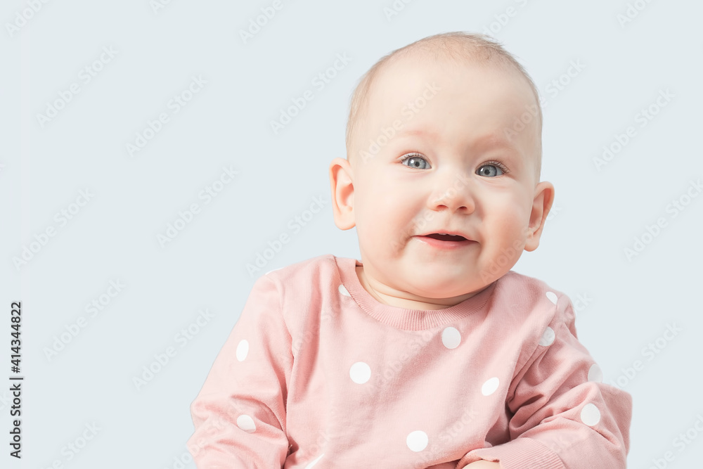 Child portrait on a blue background with place for your text.