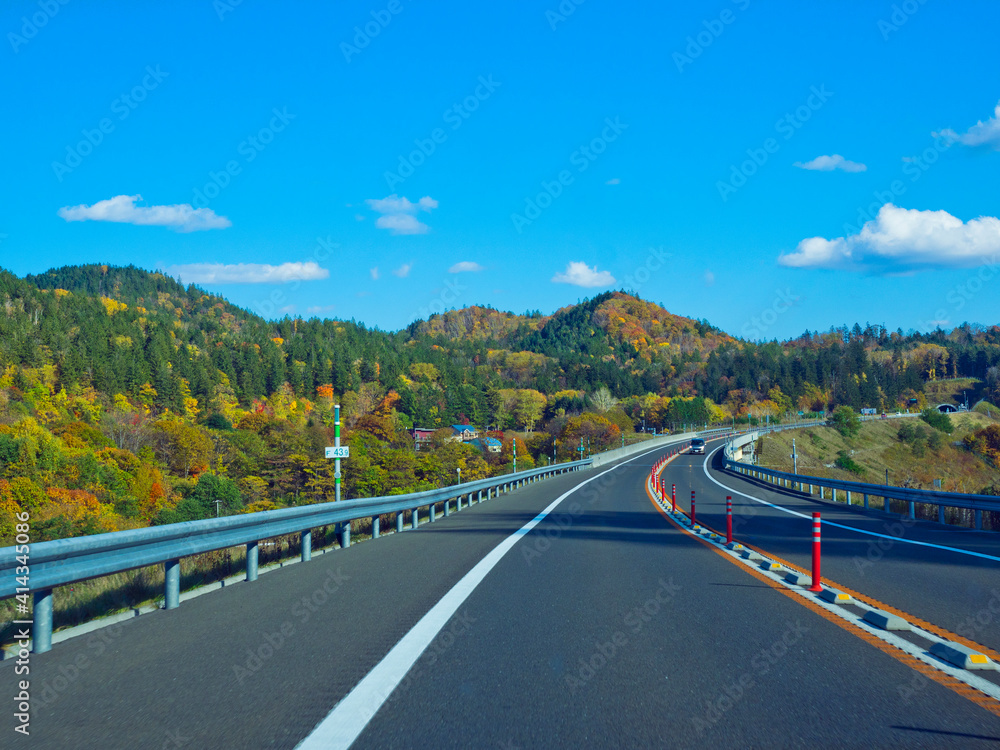 The rural road on Hokkaido expressway in Autumn season. The rural road on Hokkaido expressway in Autumn season.