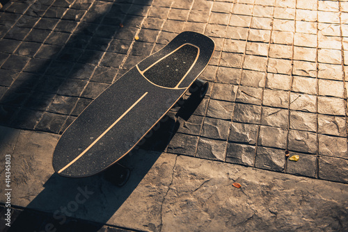 Photography Close up surf skate or skateboard at park sunset