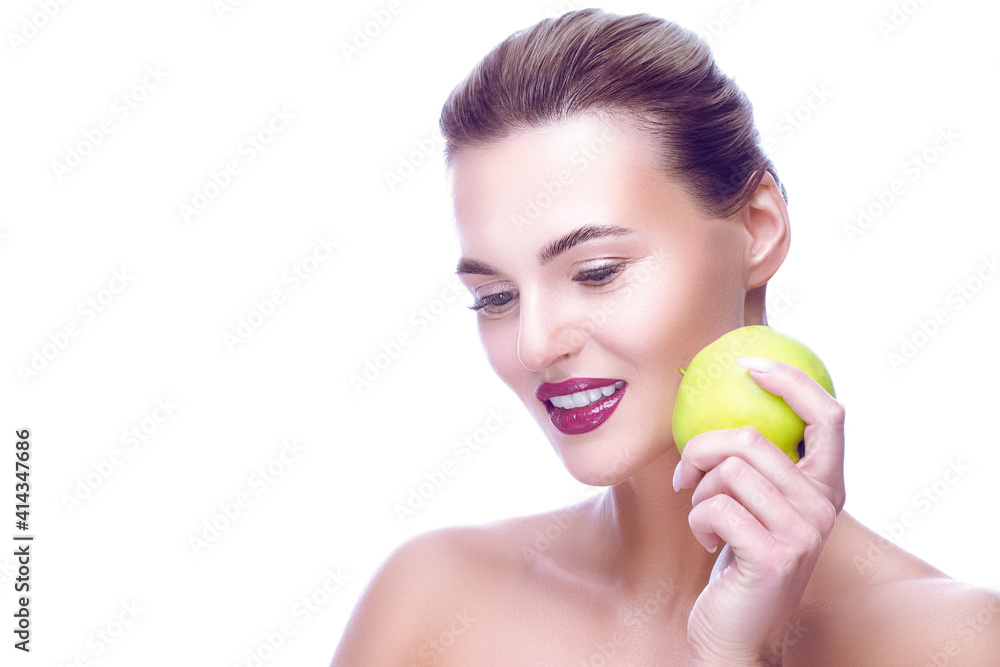 Dentistry Concept and Ideas. Portrait of Caucasian Woman with Perfect Smile Posing With Green Apple Against Pure White Background Dentistry Concept and Ideas. Portrait of Caucasian Woman with Perfect Smile Posing With Green Apple Against Pure White Background