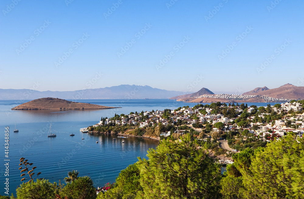 Aegean coastline with wonderful blue water, rich nature, islands, mountains and small white houses. Summer vacation concept