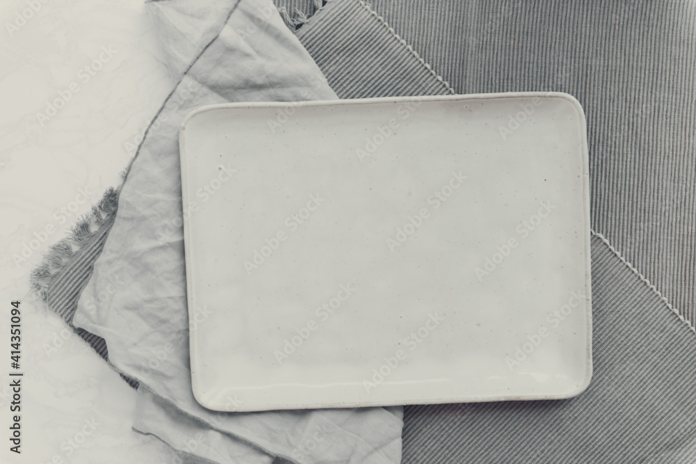 Empty dish gray background flat lay Empty dish gray background flat lay