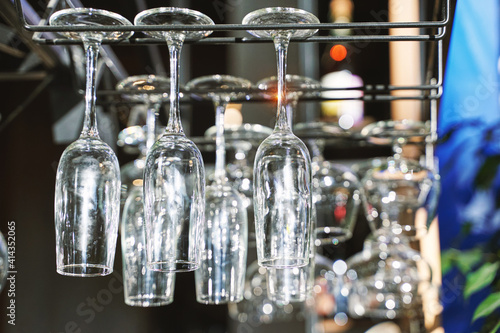 Wine glasses upside down. Clean cafe drink cup. Empty bar. Bistro backdrop. Resaturant space. Customer bistro