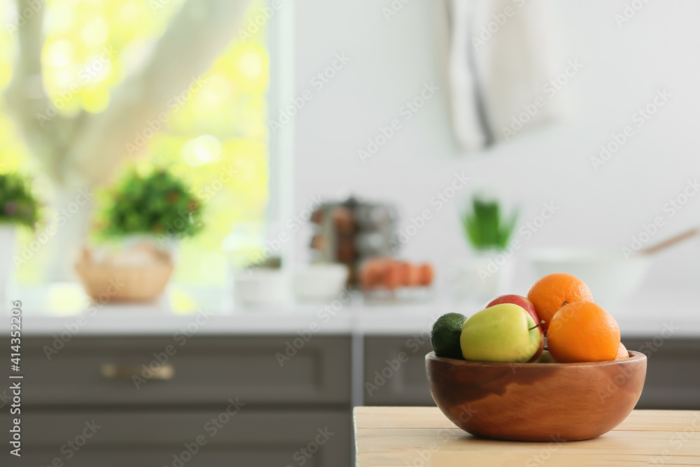 Bowl with fruits on table in modern kitchen Bowl with fruits on table in modern kitchen