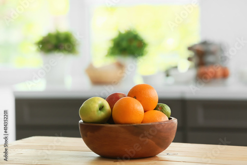 Fototapeta Naklejka Na Ścianę i Meble -  Bowl with fruits on table in modern kitchen