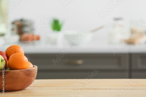 Fototapeta Naklejka Na Ścianę i Meble -  Bowl with fruits on table in modern kitchen