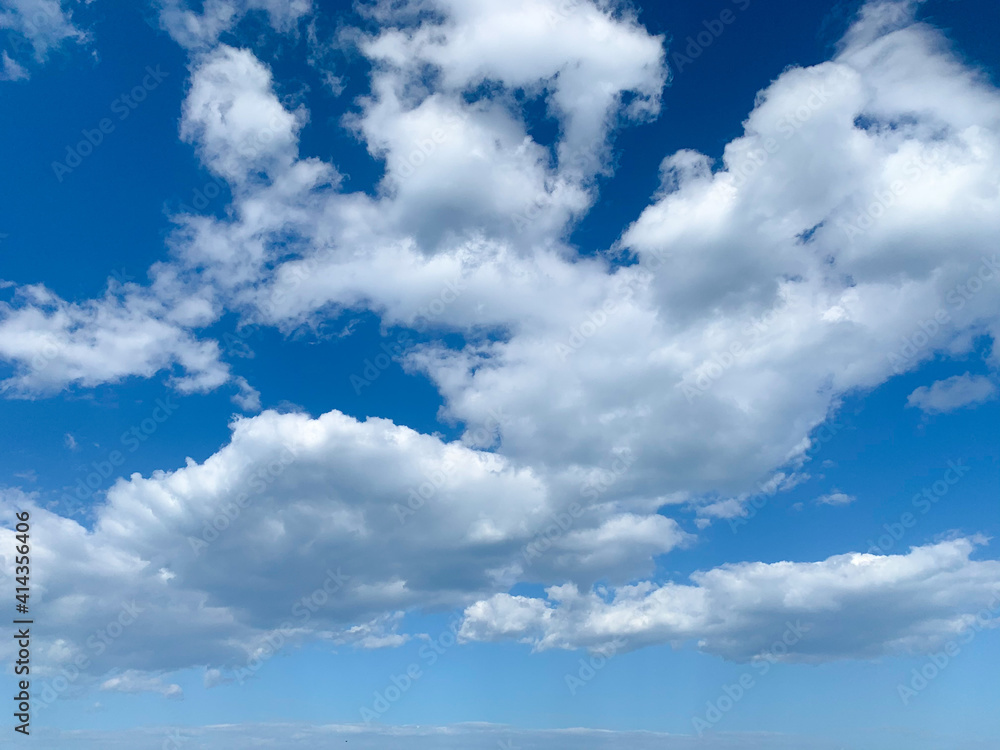 Blue cloudy sky, white clouds background.