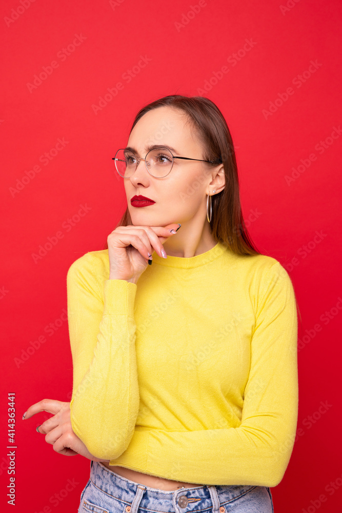 Portrait of a young woman in a yellow jacket