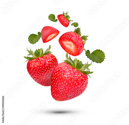 Fresh strawberries with leaves isolated on white background