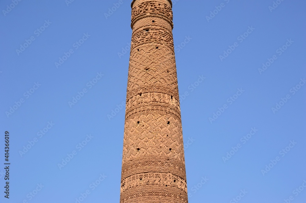 Husrevgird Minaret was built in 1111 during the Great Seljuk period. The brick decorations on the minaret are remarkable. Sebzevar, Razavi Khorasan Province, Iran.