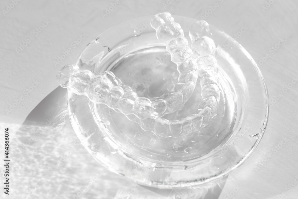 Invisible transparent aligners plastic braces dentistry retainers on glass