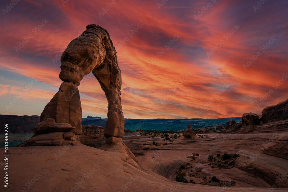 Utah's landmark Delicate Arch at sunset with a beautiful evening atmosphere