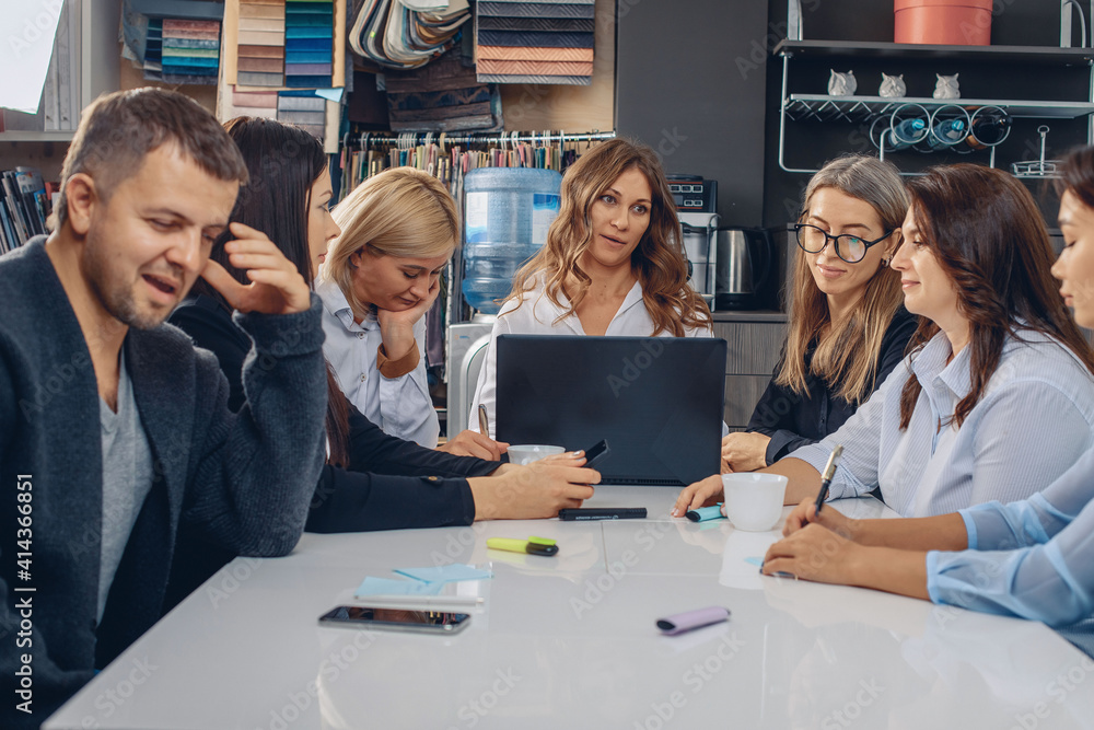Meeting of office workers. Professional cute and young boss woman in the center of the table discussing projects with colleagues and analyzing very emotionally. Meeting of office workers. Professional cute and young boss woman in the center of the table discussing projects with colleagues and analyzing very emotionally.