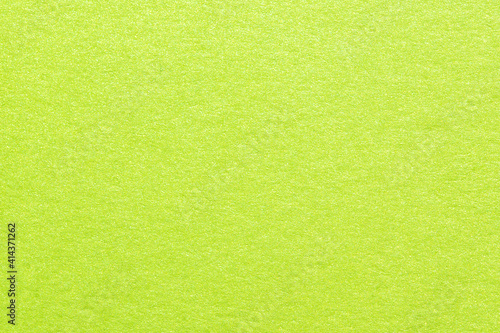 Texture of green shiny metallic paper