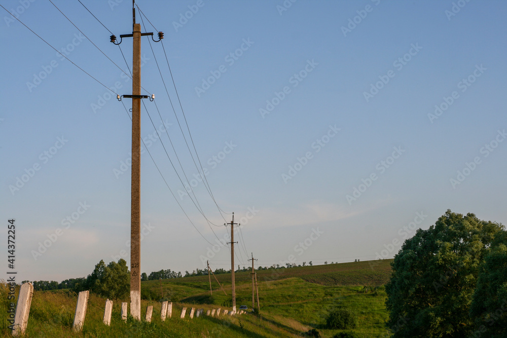powerlines electric poles along a country road