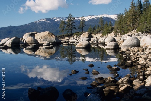  mirror reflection in the lake of the mountains in spring at Lake Tahoe, CA