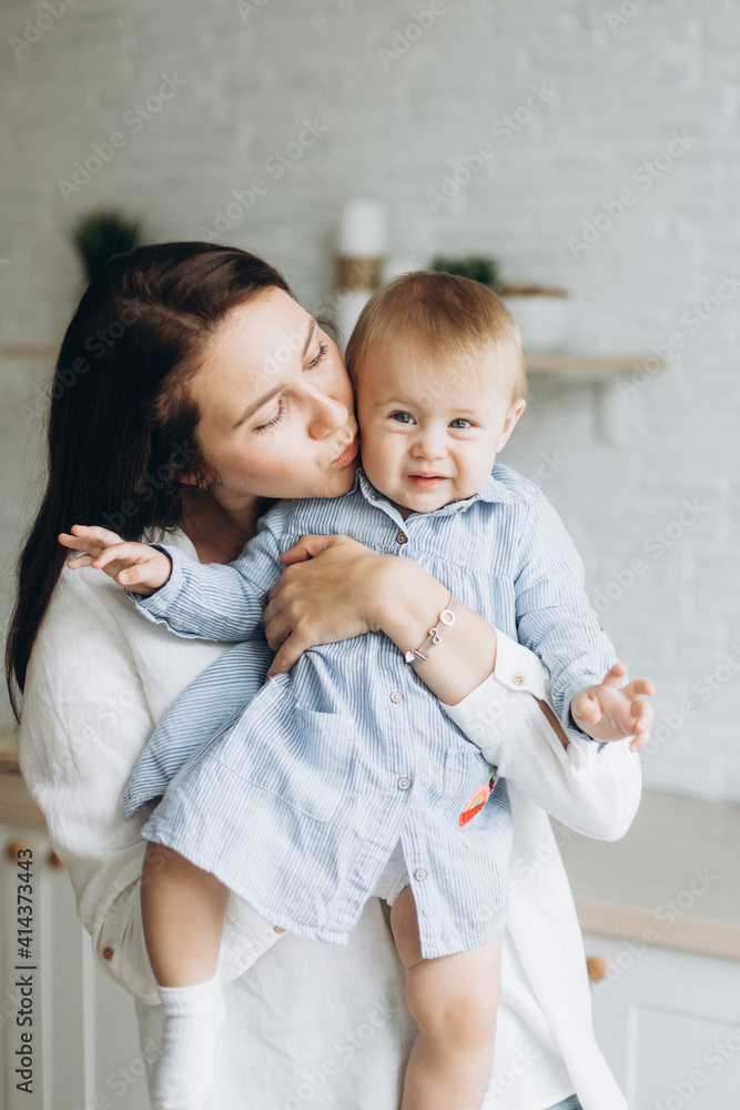 Happy mother and infant daughter playing together at home. Childhood, family concept Happy mother and infant daughter playing together at home. Childhood, family concept