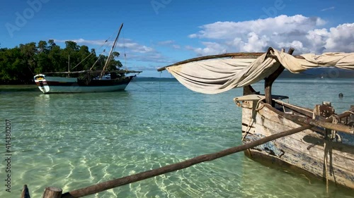 White sand and transparent sea water. Nosy Iranjia near Nosy Be in Madagascar. Two islands connected by a tongue of sand influenced by the tide. Typical Malagasy boat. Panoramas of Madagascar.  Love.