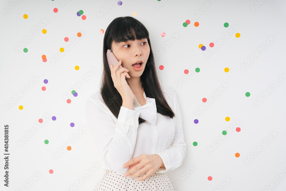 Cheerful beautiful asian thai long dark hair woman with smartphone isolate over white background. Cheerful beautiful asian thai long dark hair woman with smartphone isolate over white background.