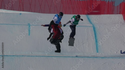 Winter sport. Snowboard cross. Cross-country snowboard track. Athletes on a snowboard. Snowboard competition. photo