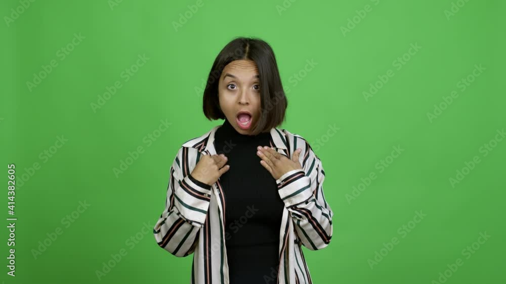 Woman gaping because have just surprised with a gift over isolated background Woman gaping because have just surprised with a gift over isolated background
