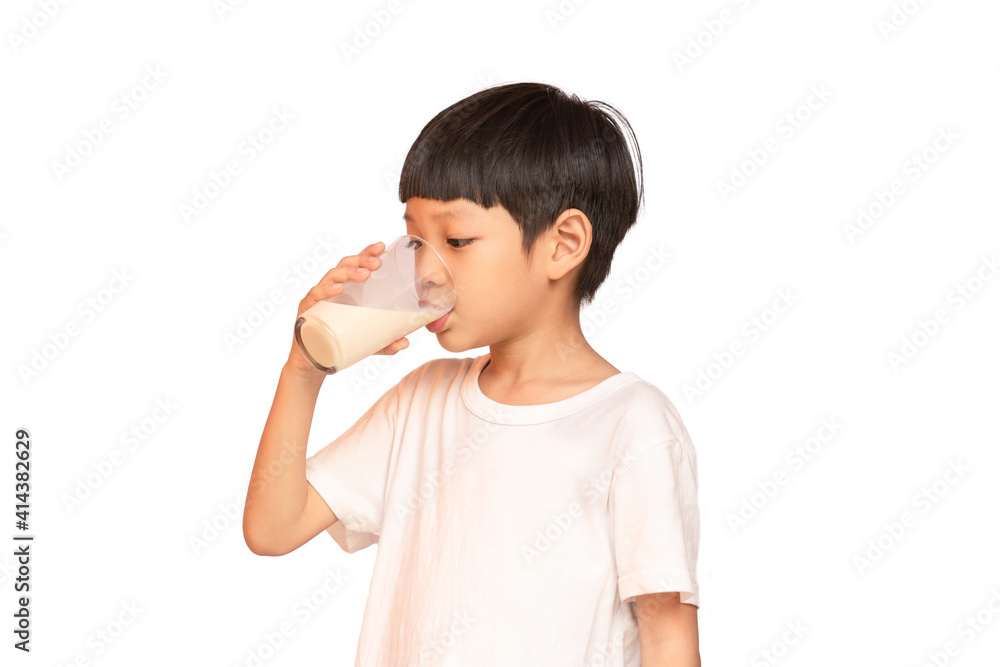 Asian pretty boy drinking the milk isolated on white background. Asian pretty boy drinking the milk isolated on white background.