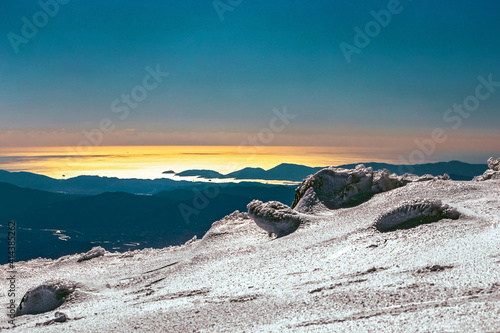 Snow-capped mountain panorama on Mediterranean sea, Appennino Emiliano photo