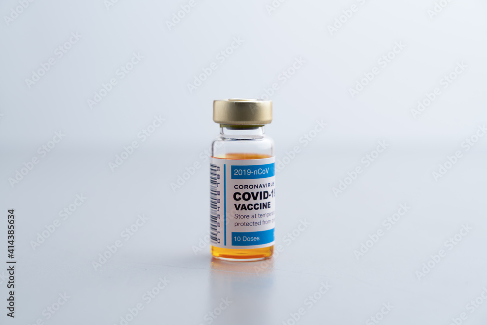 ampoules or vials with Covid-19 vaccine on a laboratory bench. SARS-CoV-2 Vaccination, immunization, treatment to cure Covid 19 Corona Virus infection. Medical concept. ampoules or vials with Covid-19 vaccine on a laboratory bench. SARS-CoV-2 Vaccination, immunization, treatment to cure Covid 19 Corona Virus infection. Medical concept.