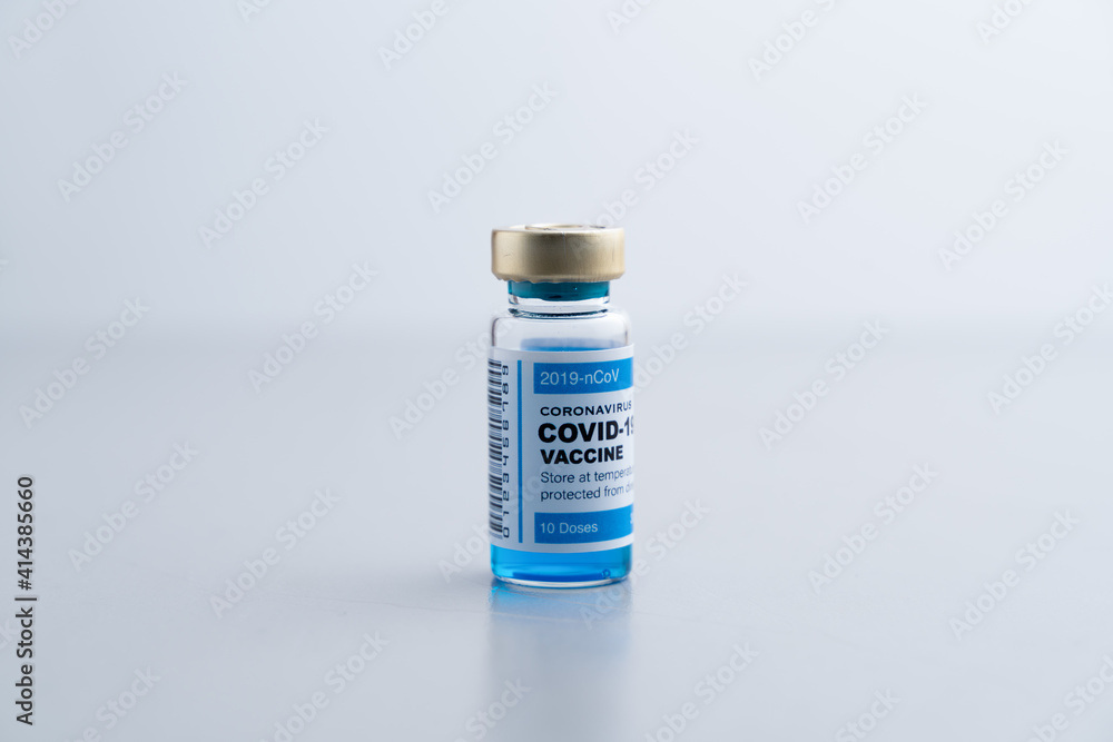 ampoules or vials with Covid-19 vaccine on a laboratory bench. SARS-CoV-2 Vaccination, immunization, treatment to cure Covid 19 Corona Virus infection. Medical concept. ampoules or vials with Covid-19 vaccine on a laboratory bench. SARS-CoV-2 Vaccination, immunization, treatment to cure Covid 19 Corona Virus infection. Medical concept.